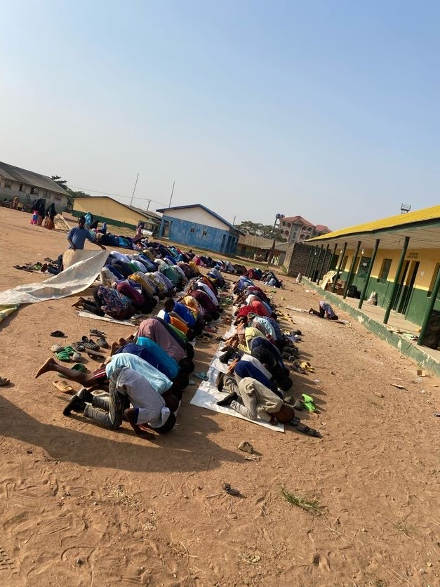SUDAI members gathered outdoors for prayer